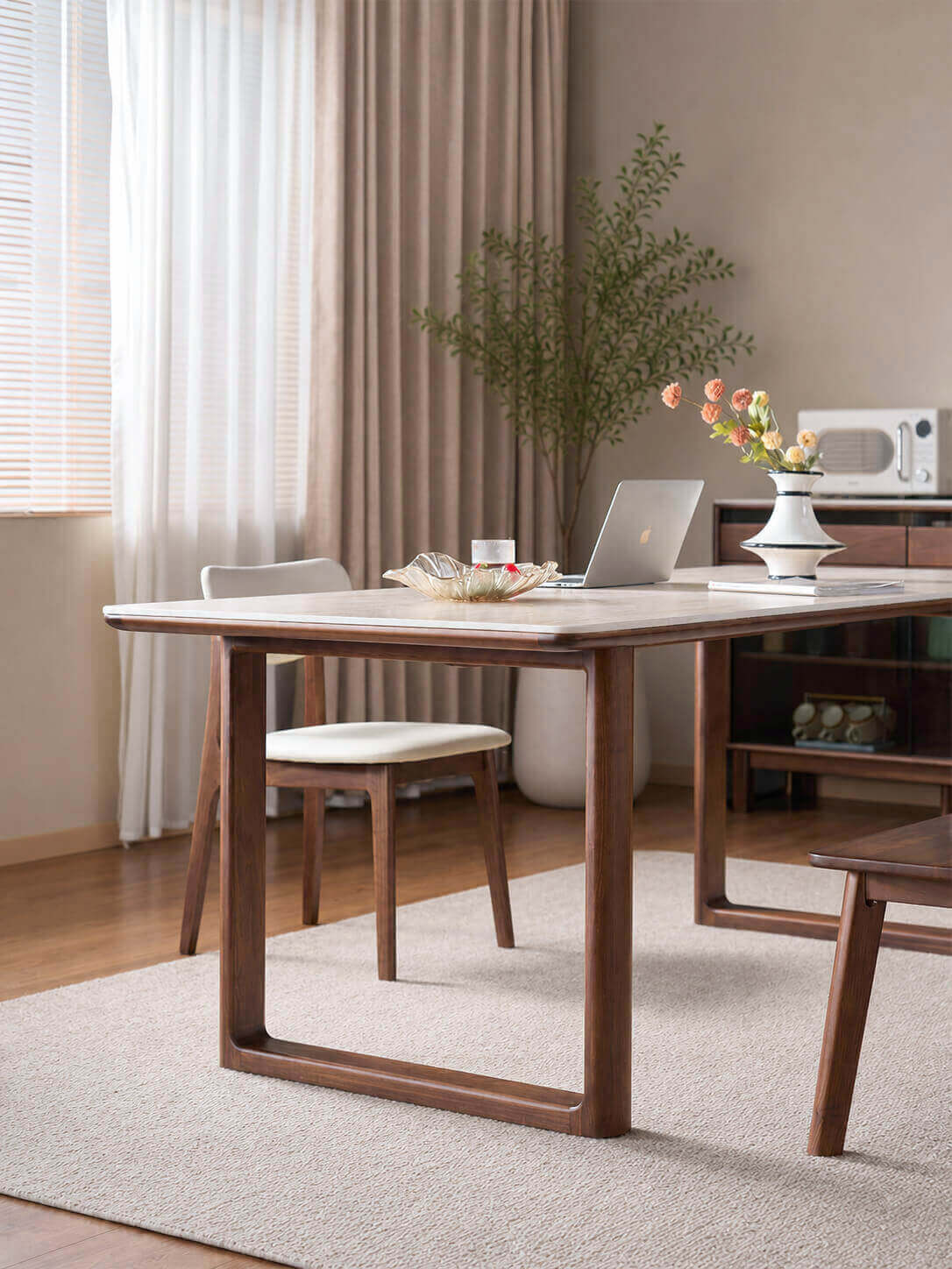 Forma Solid Walnut Sintered Stone Dining Table showing adjustable leg position