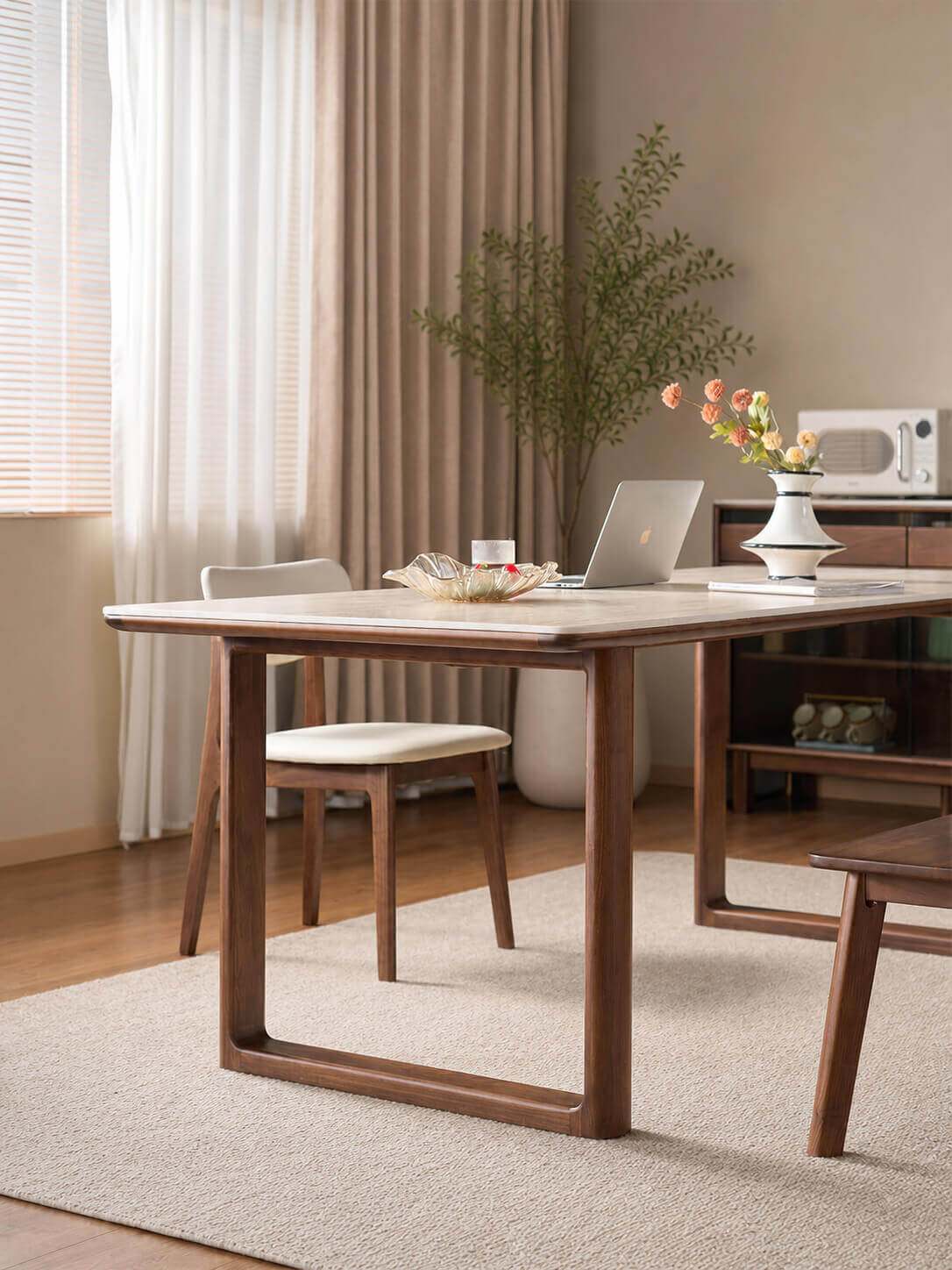 Forma Solid Walnut Sintered Stone Dining Table showing adjustable leg position