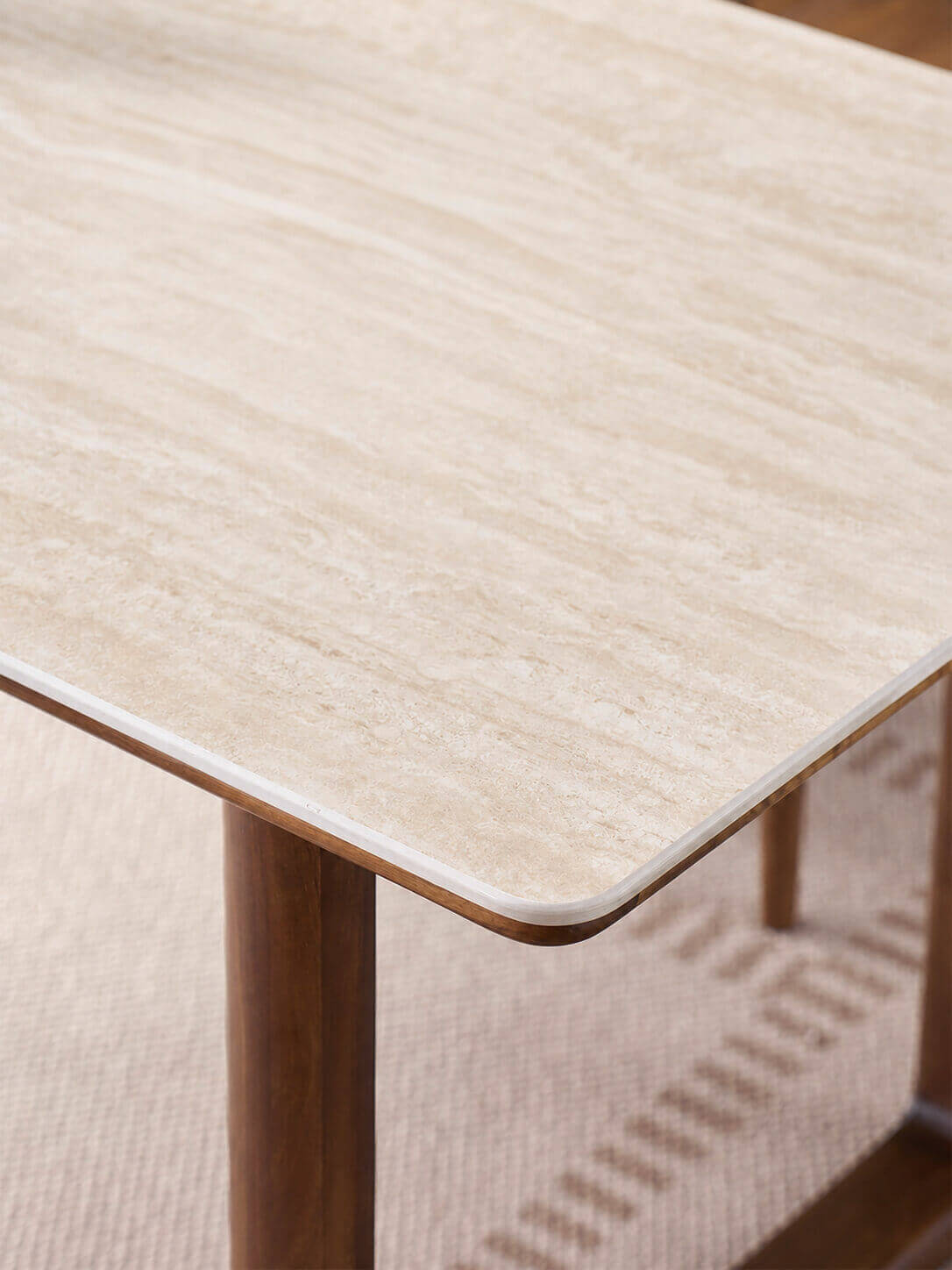 Premium sintered stone tabletop detail on the Forma Dining Table