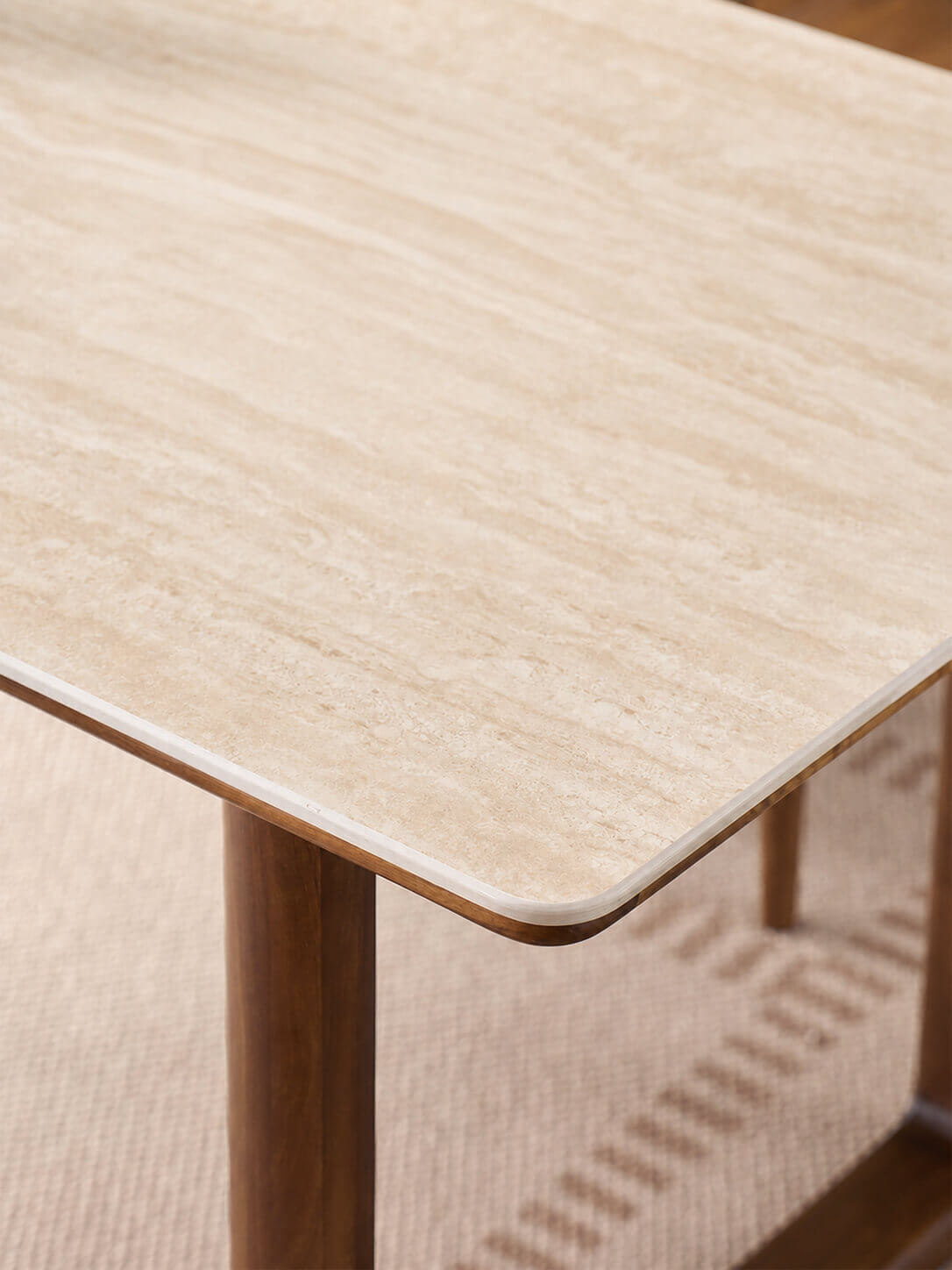 Premium sintered stone tabletop detail on the Forma Dining Table