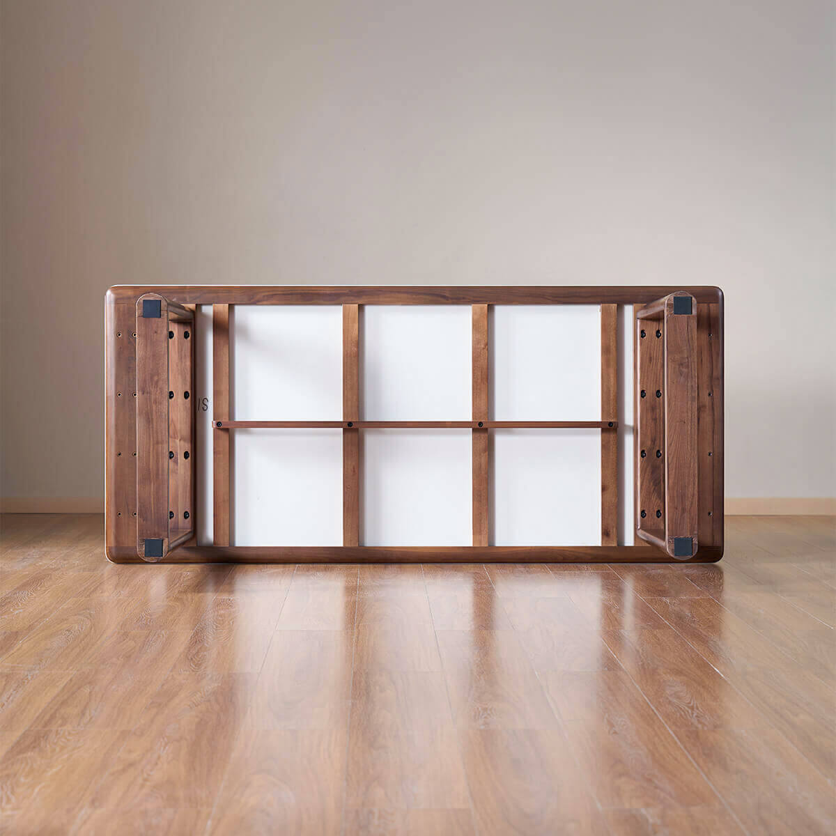 Underside construction of the Forma Solid Walnut Sintered Stone Dining Table