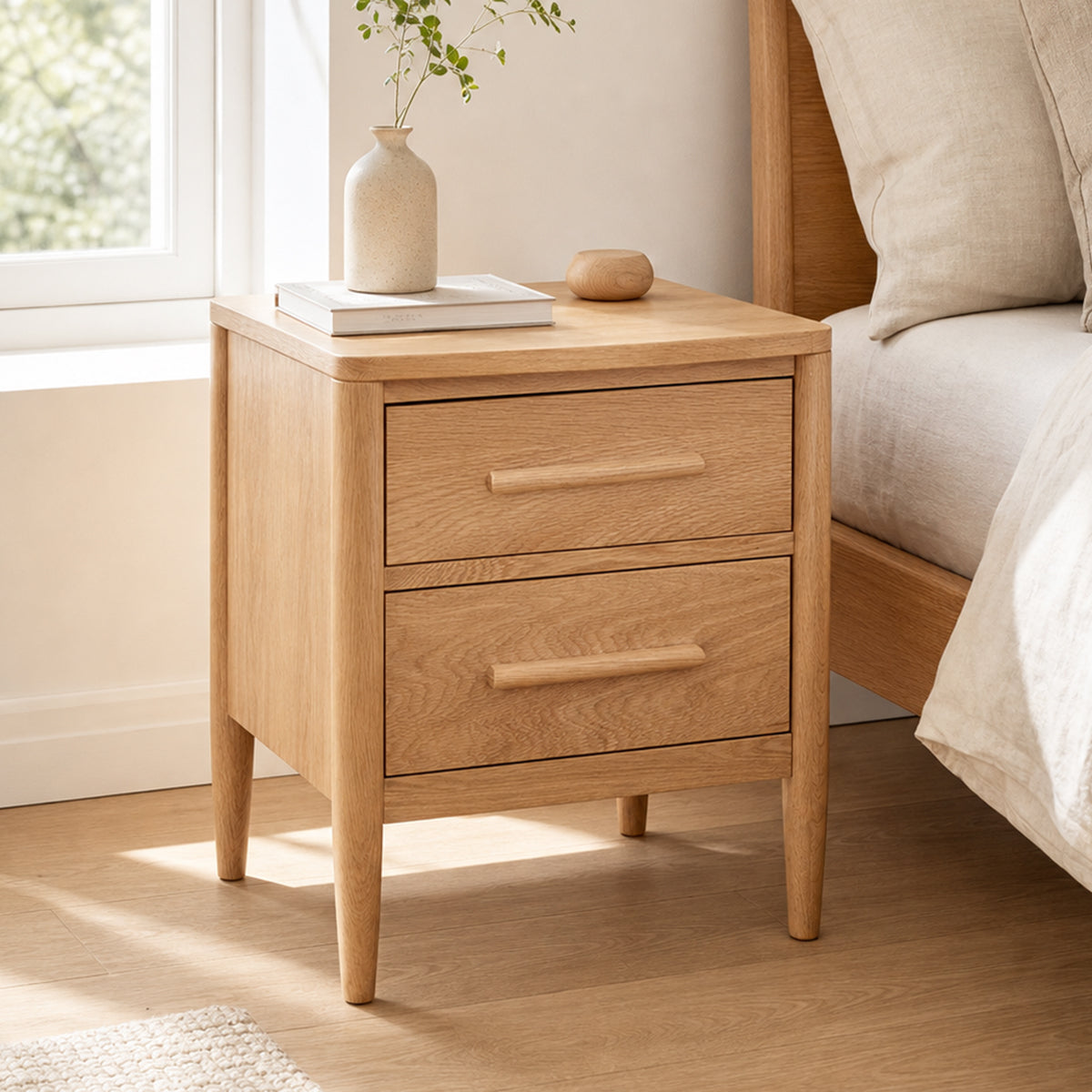 Fuji Solid Oak Bedside Table in a bright Scandinavian bedroom with natural oak timber finish