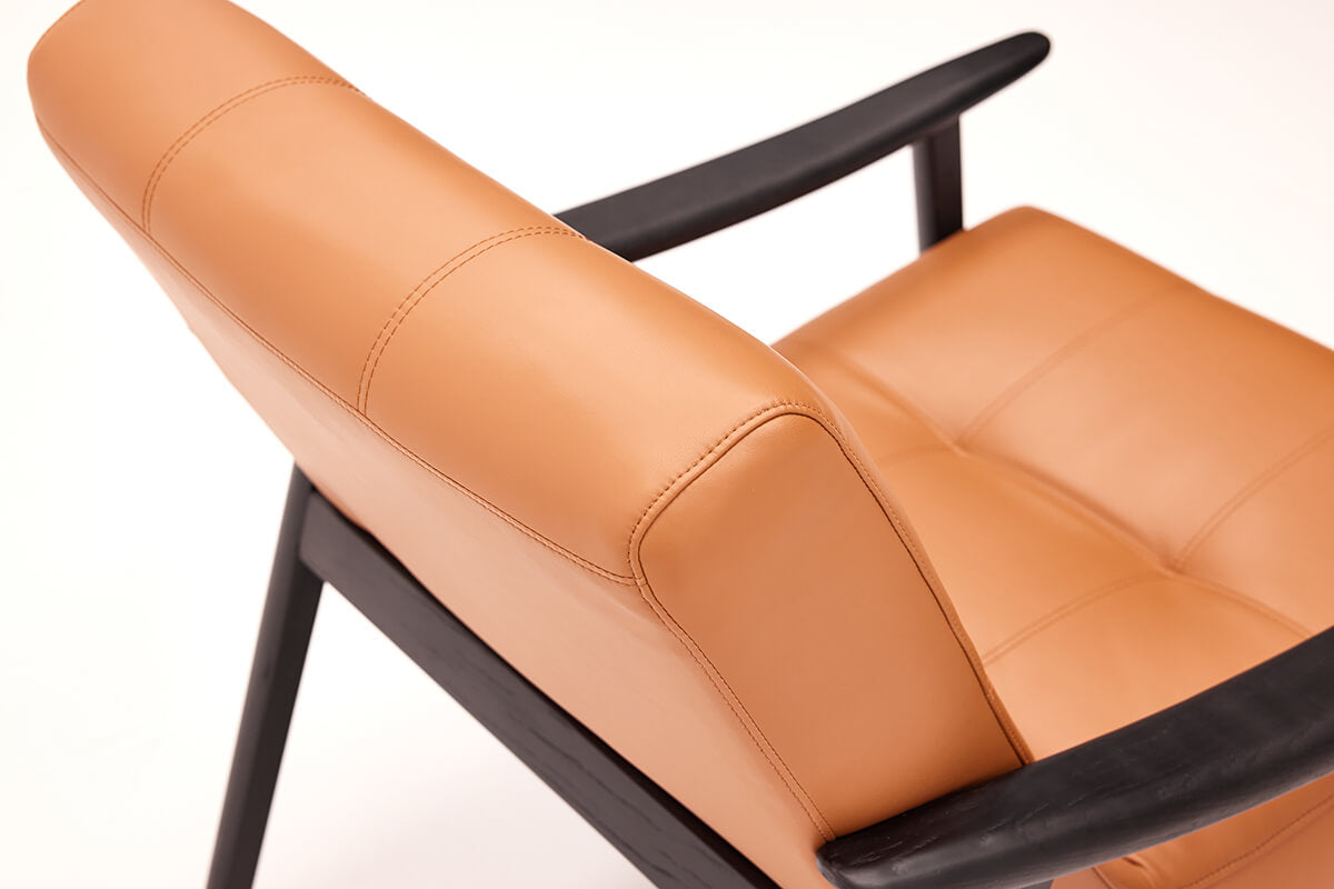 Full grain leather backrest detail of Fynn armchair