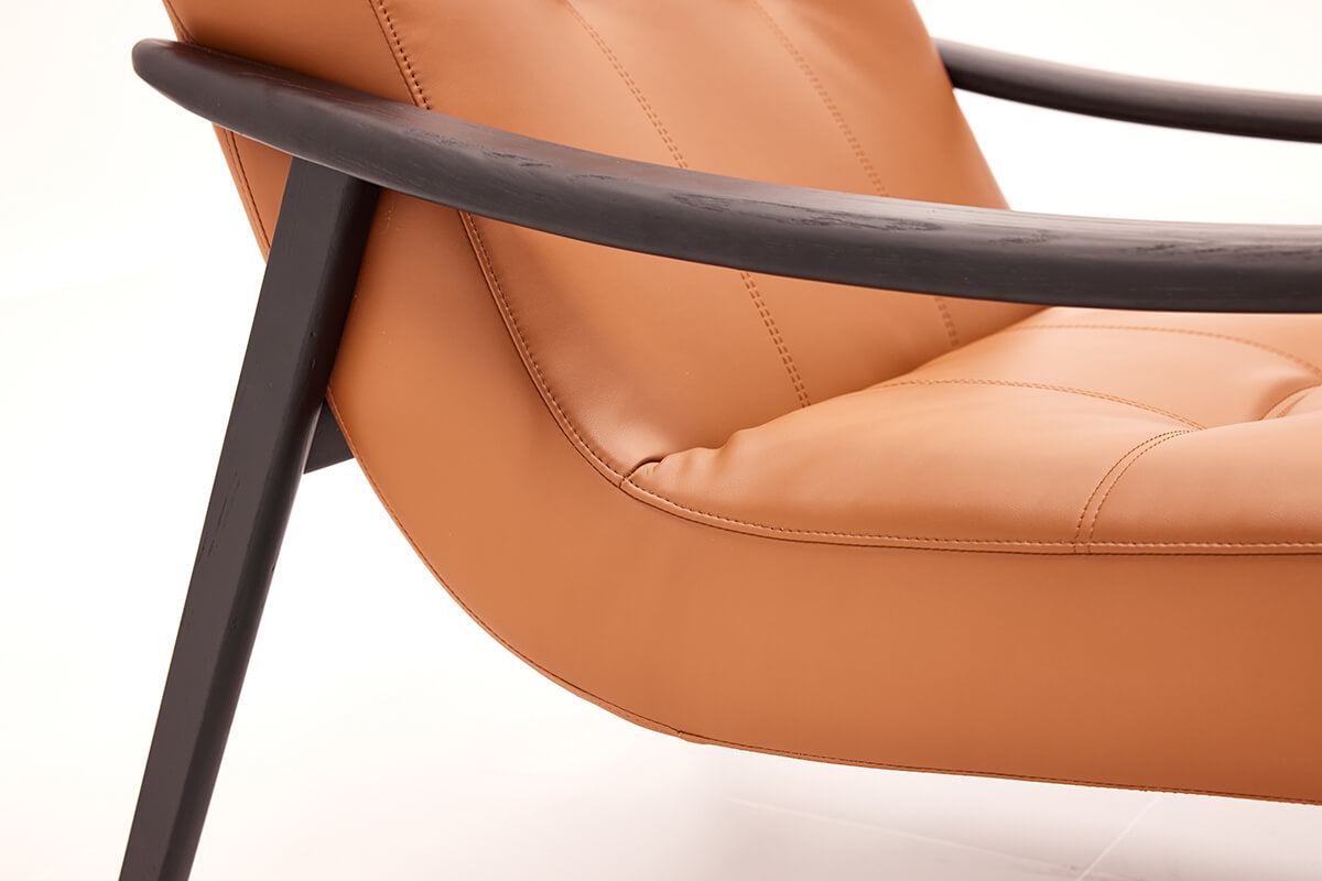 Solid timber armrest detail of Fynn leather armchair