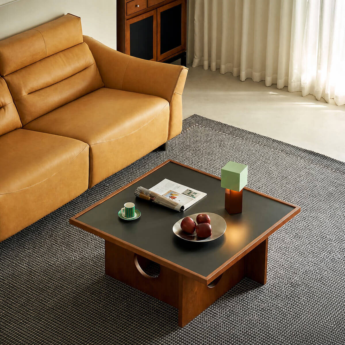 Gentle Black Sintered Stone Coffee Table styled in a contemporary living room