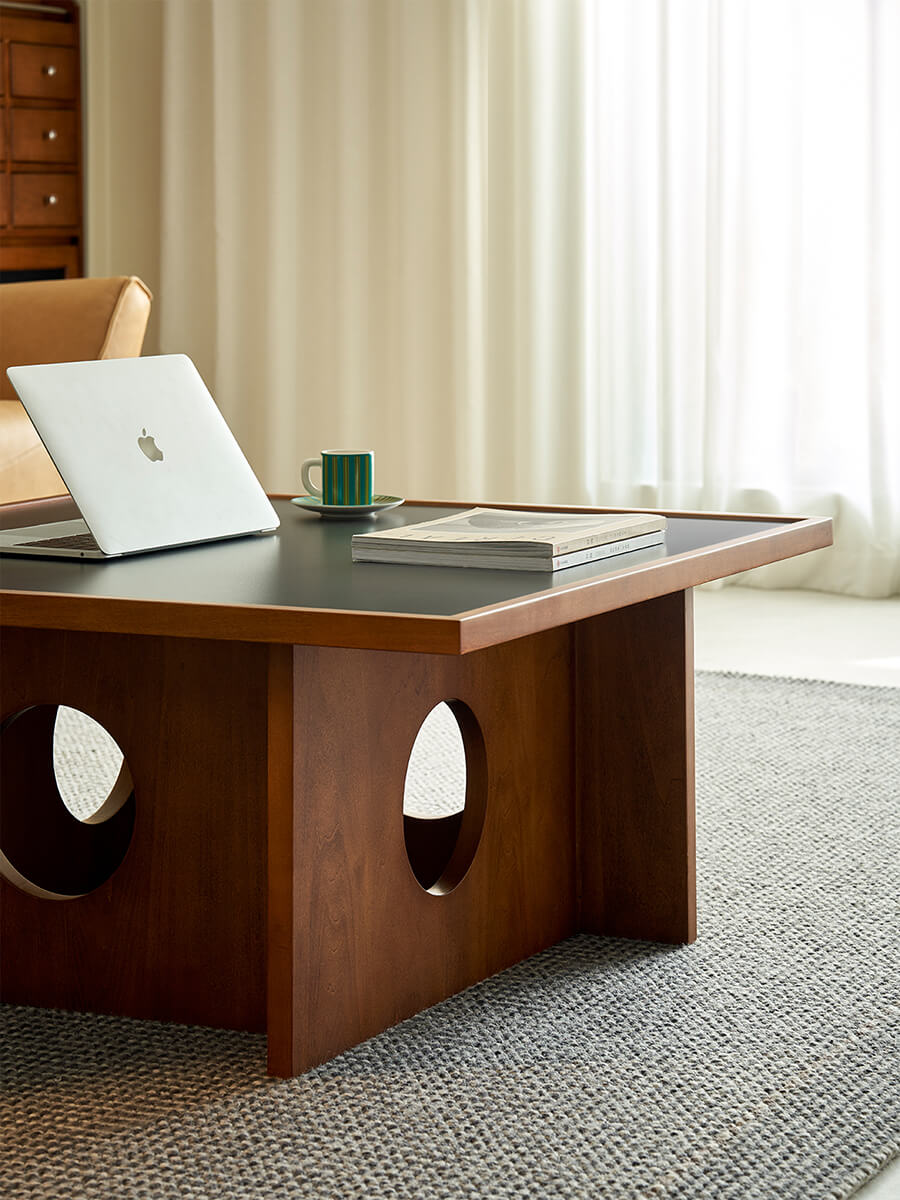 Gentle Black Sintered Stone Coffee Table used as a modern workspace