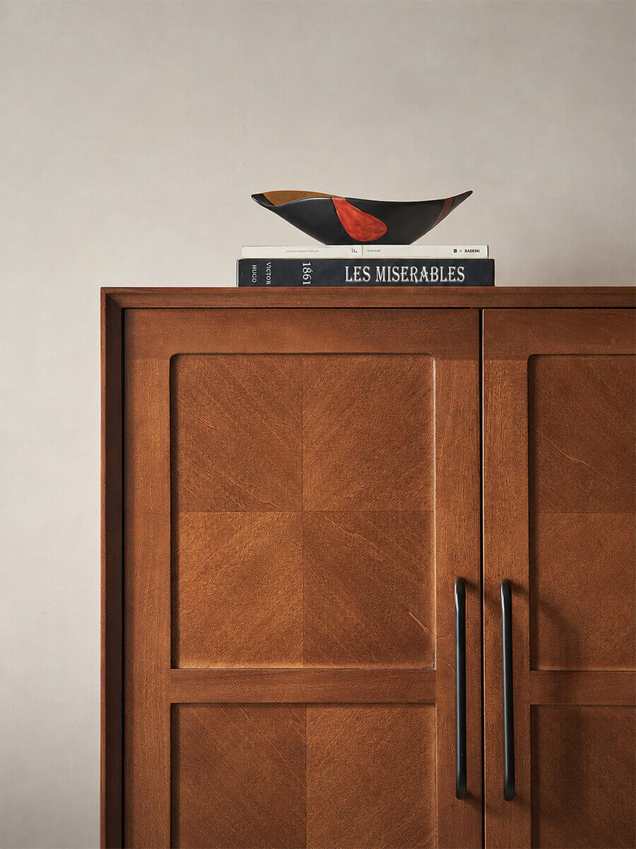 Close-up of the Gentle Designer Cabinet door panels showcasing the timber grain and metal handles