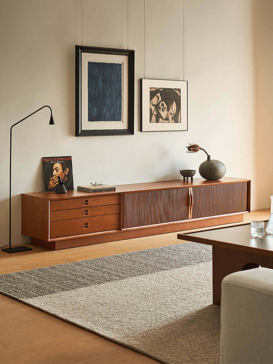 Gentle Tambour TV Unit in natural finish styled in a living room