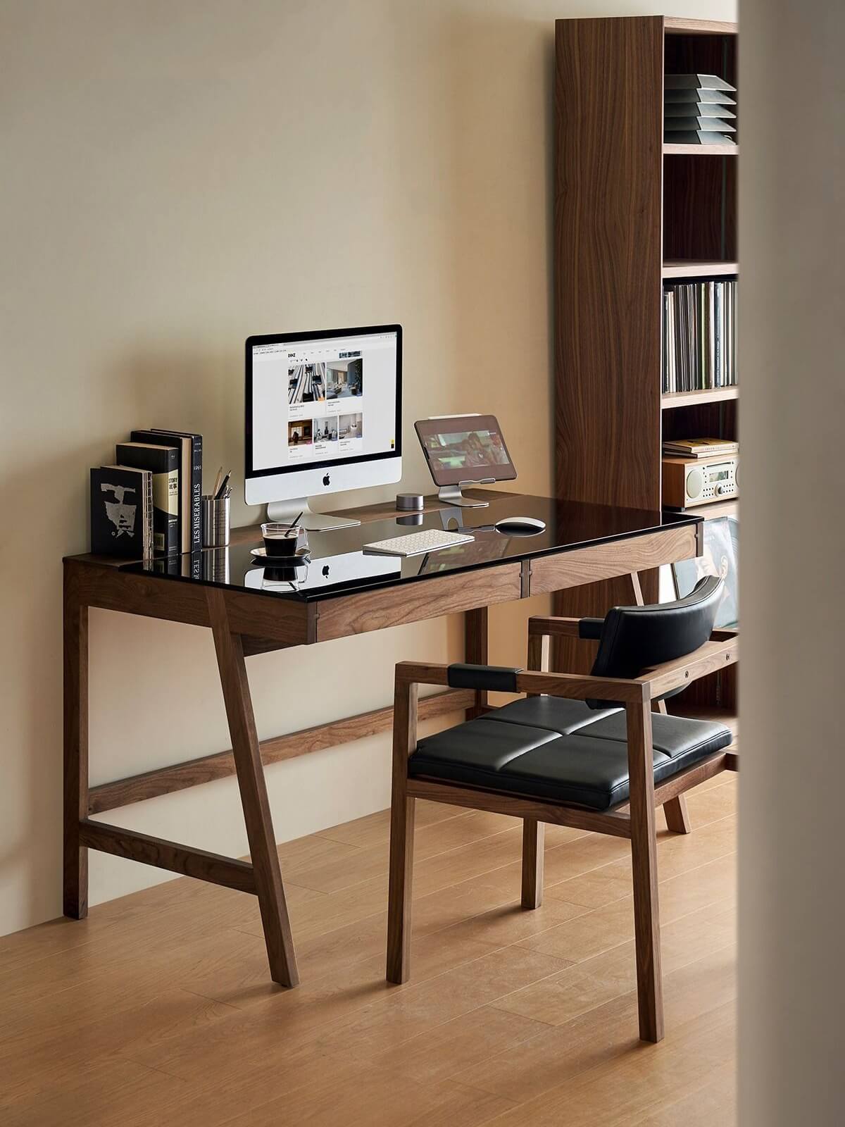 Glenn solid walnut desk with tempered glass top in a study room