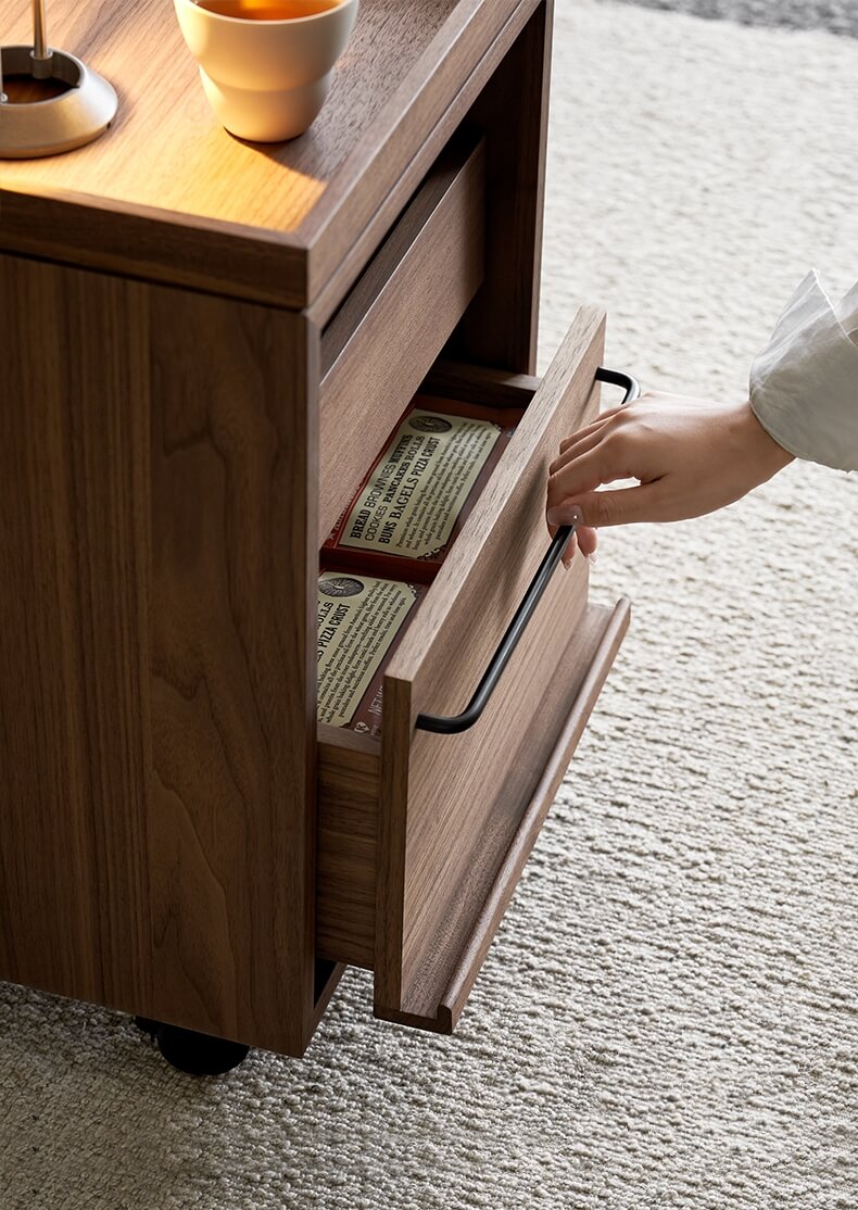 Spacious drawer detail of the Glenn walnut storage pedestal
