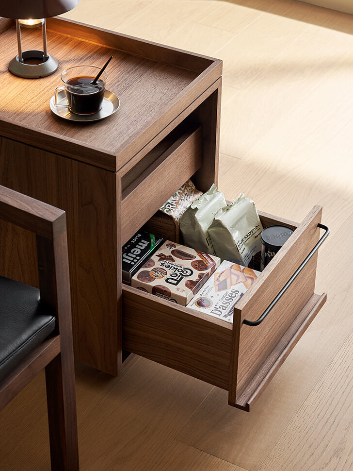 Large lower drawer of the Glenn walnut storage pedestal