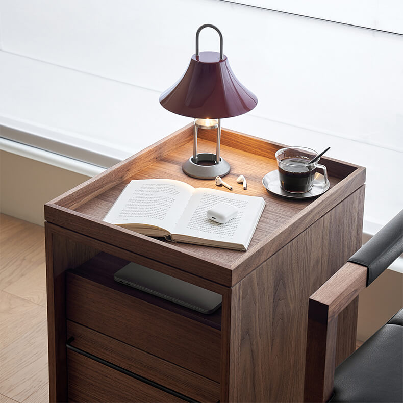 Tray top and open shelf detail of the Glenn walnut storage pedestal