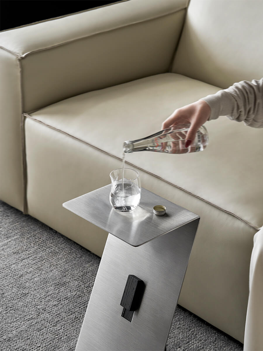 Graham side table providing a convenient surface for a drink and smartphone.