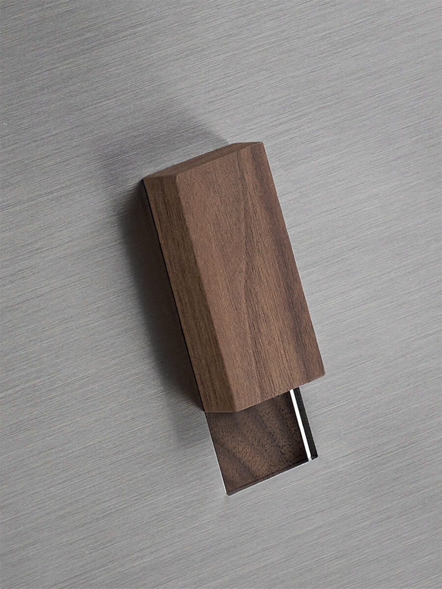 Close-up of the Graham side table showing the solid timber handle detail.