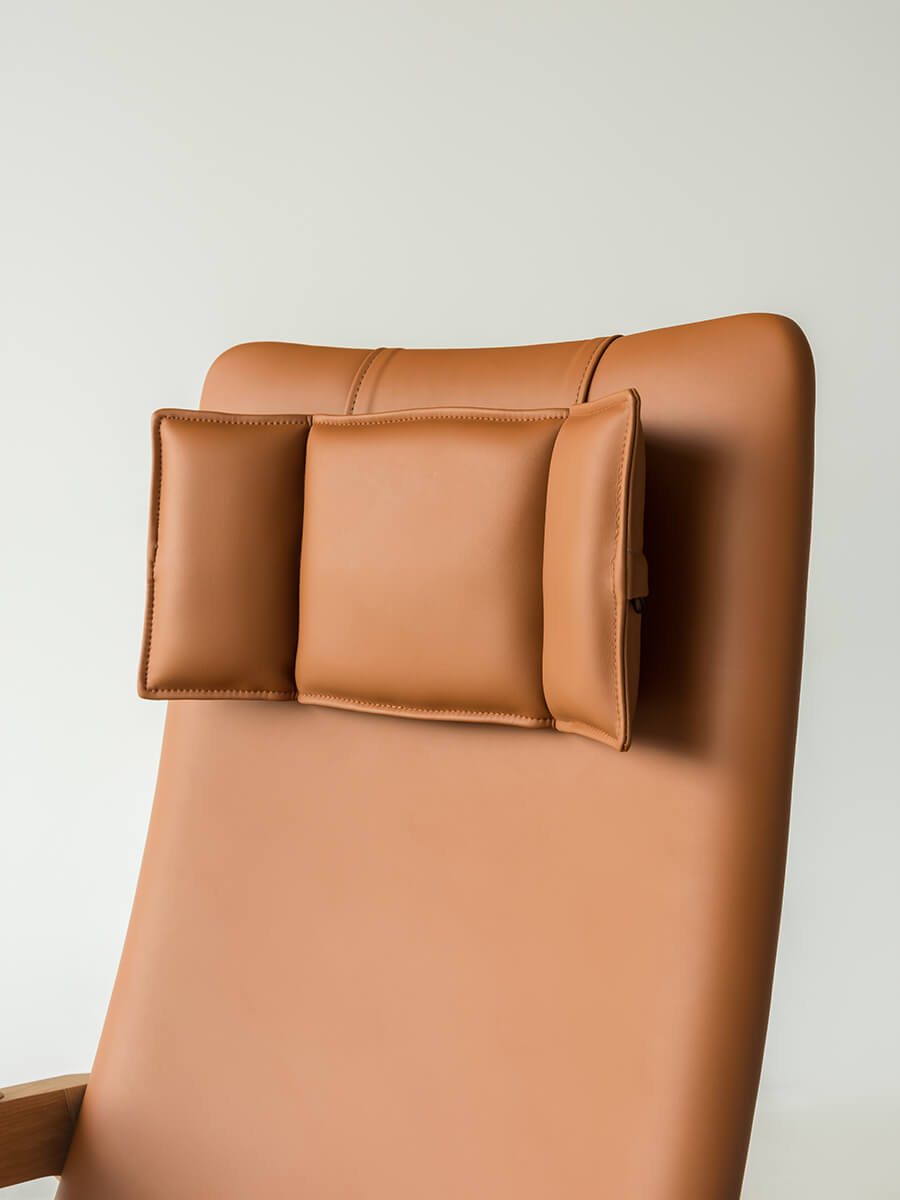Close-up of the Grant armchair high-back design with leather head cushion