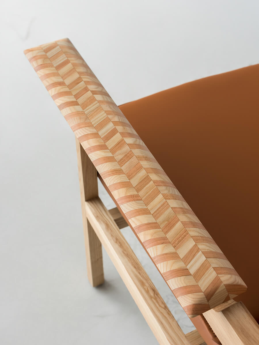Close-up of the Grant armchair timber inlay armrest detail