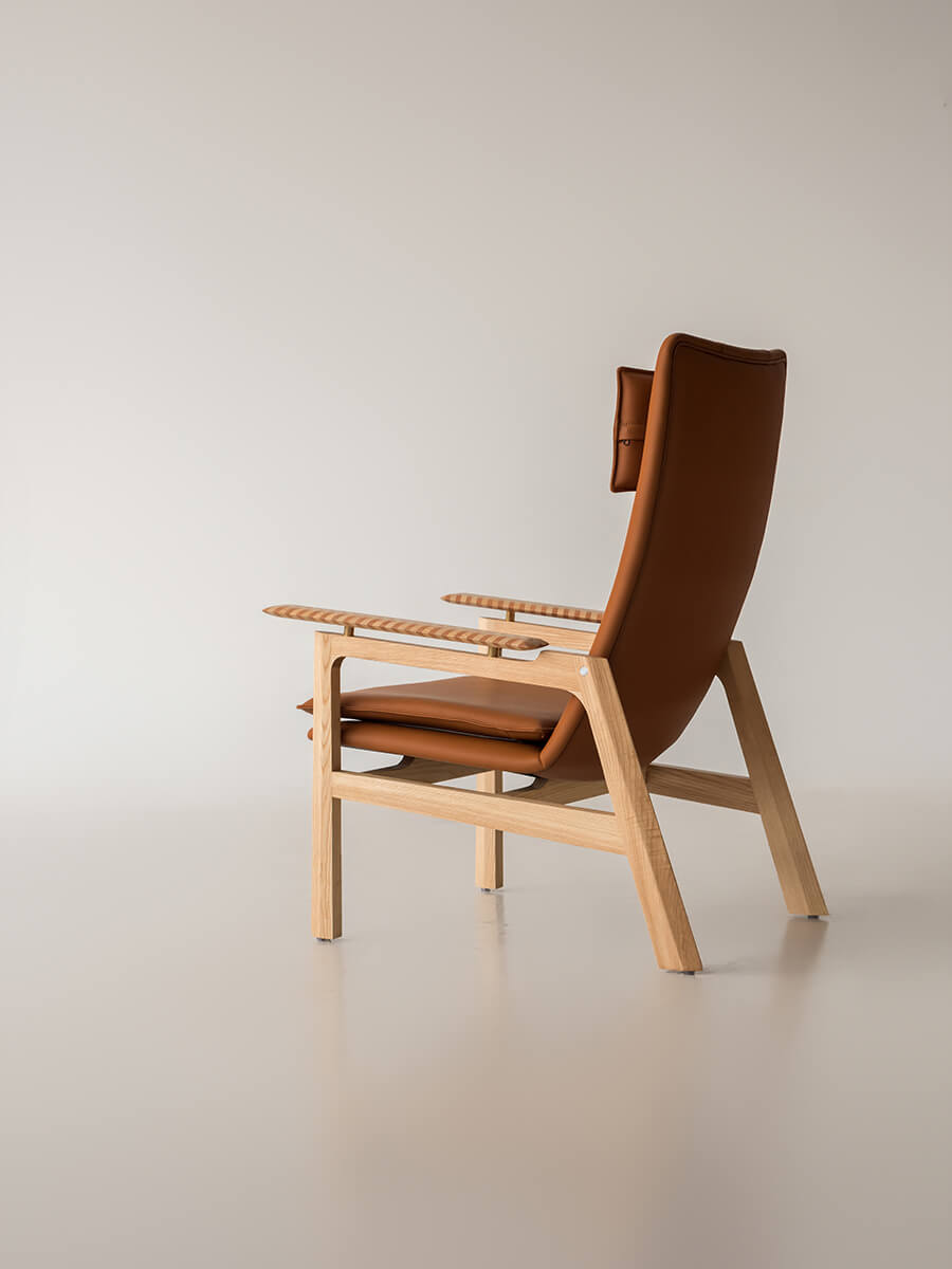Rear view of the Grant leather armchair showing solid ash timber construction