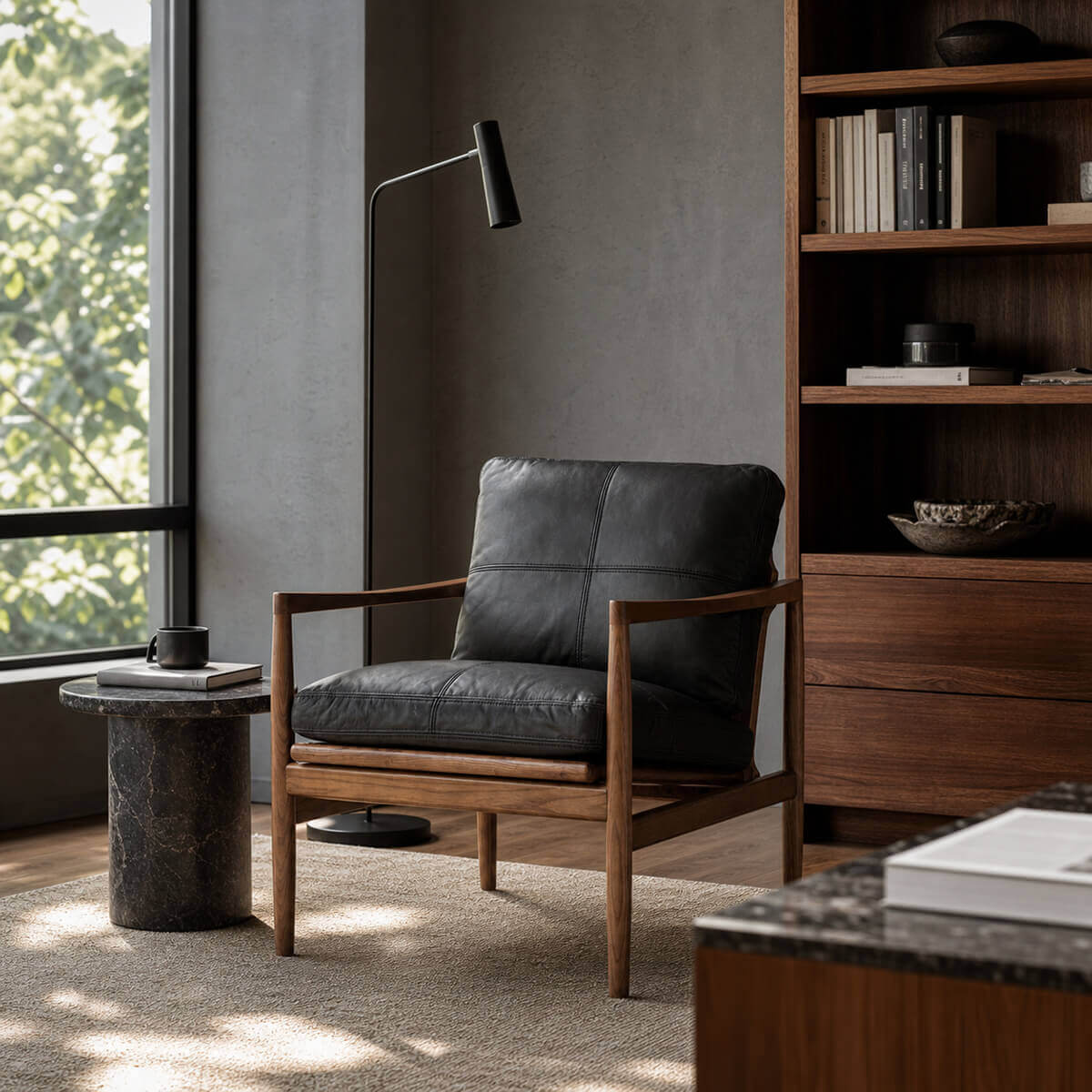 Hank black leather armchair in a modern reading corner