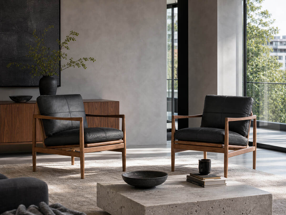 Two Hank black leather armchairs in a modern living room