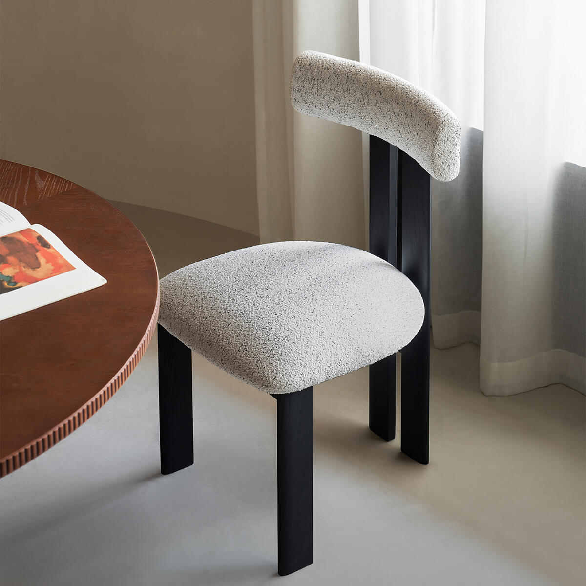 Hannah dining chair with black timber frame and upholstered seat