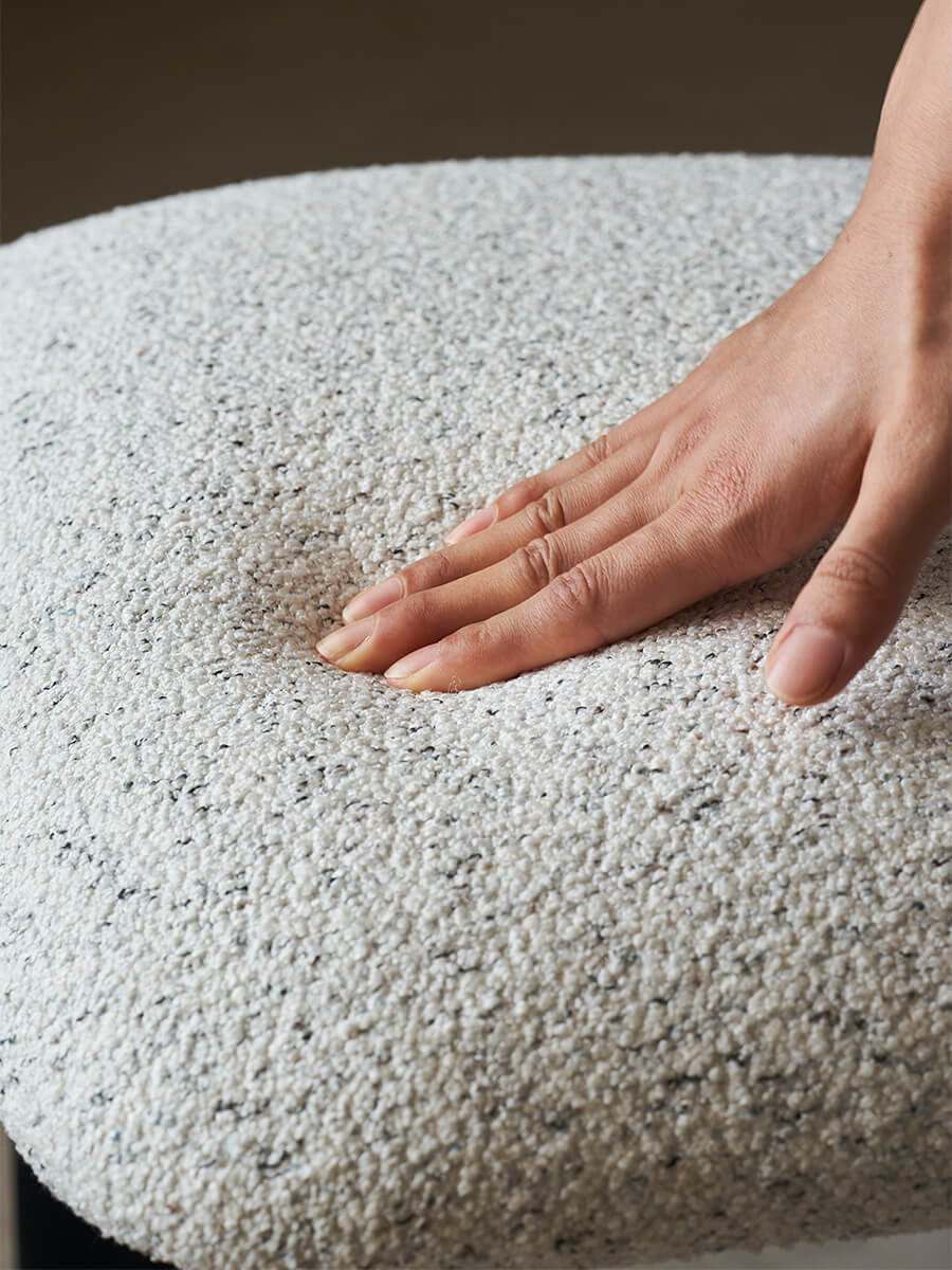 Close-up boucle upholstery detail of Hannah dining chair