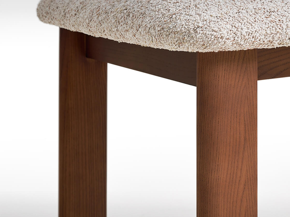 Timber leg detail of Hannah upholstered dining chair