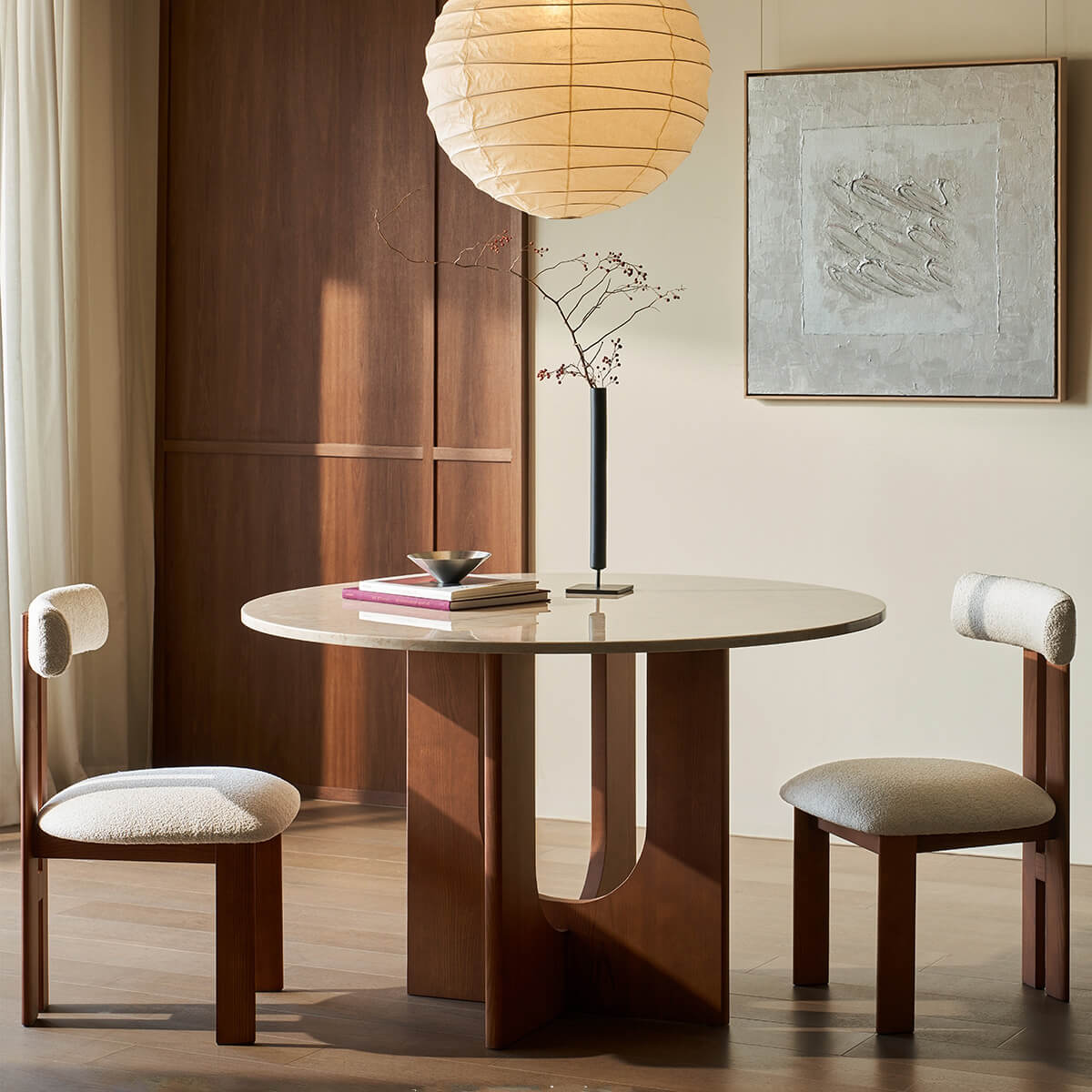 Hannah dining chair paired with round dining table in contemporary interior