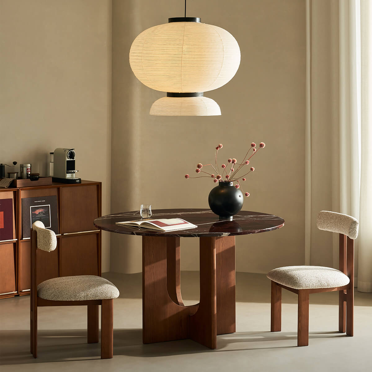 Hannah dining chair paired with round marble dining table in contemporary interior