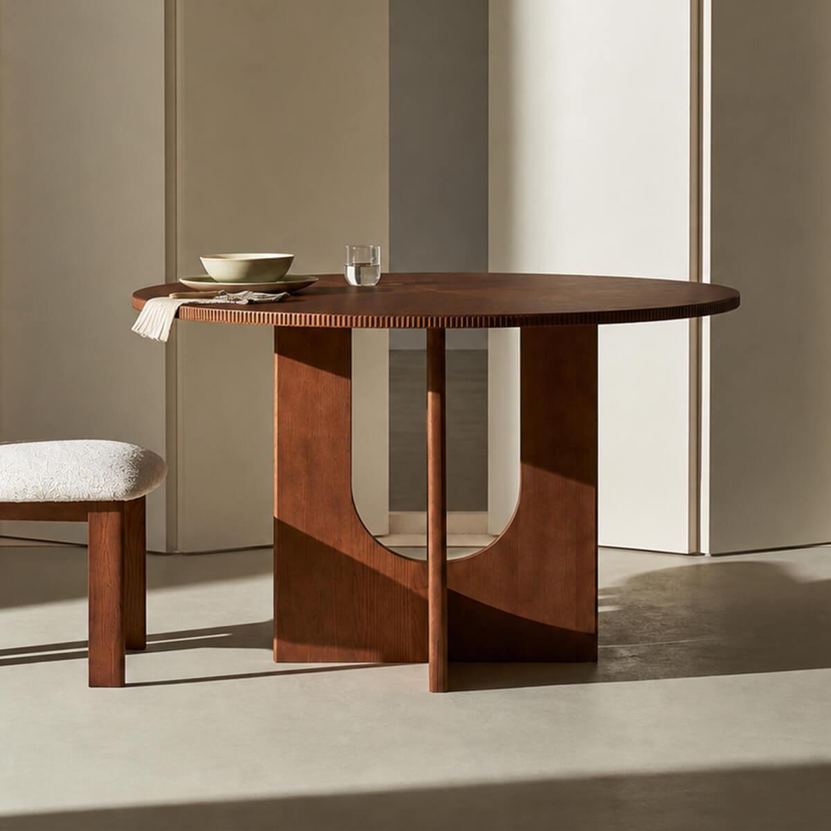 Hannah Dining Table with boxwood veneer top and sculptural timber base