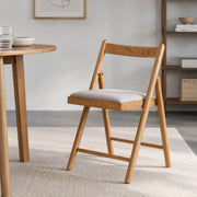Hedrich solid oak folding chair in a contemporary dining room