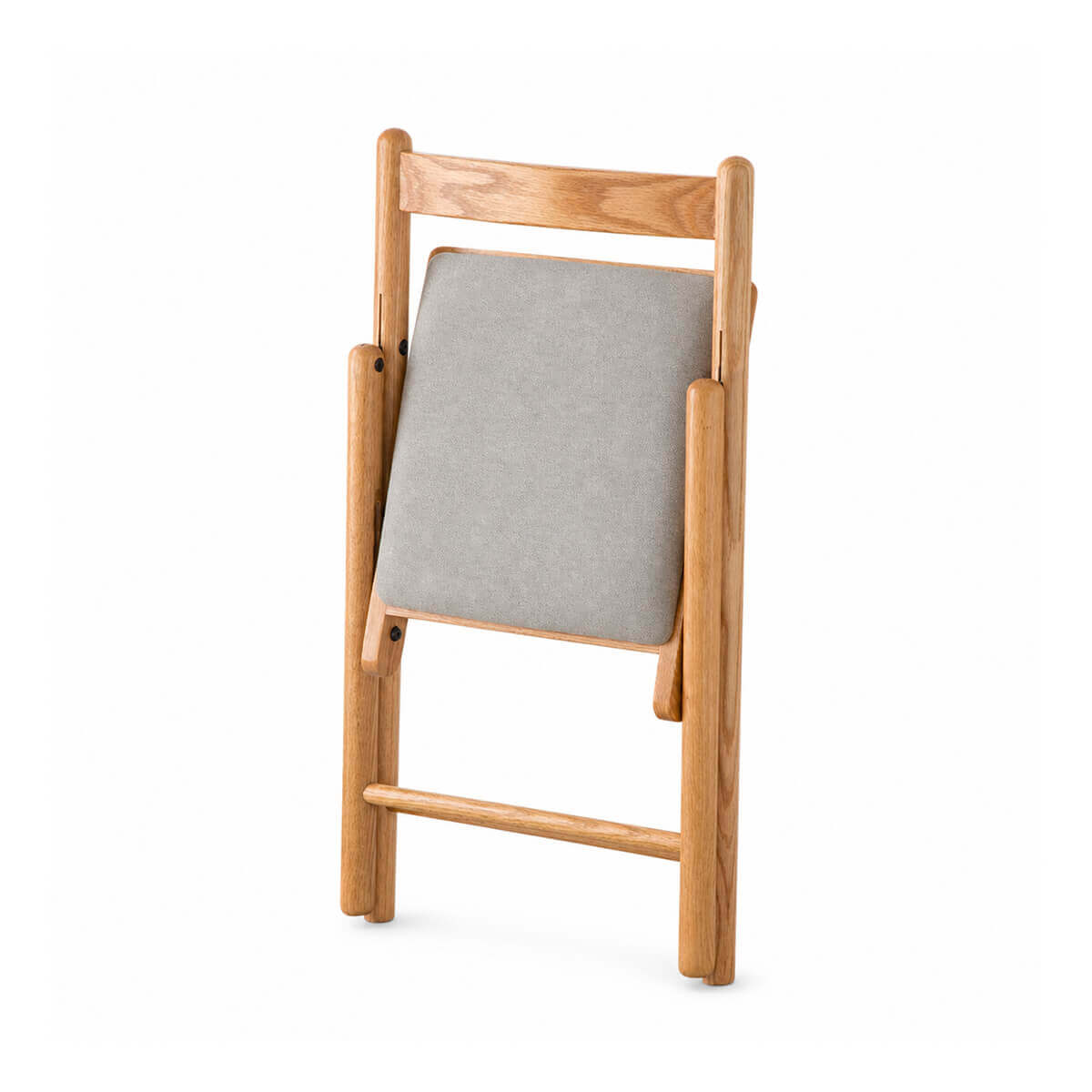 Hedrich solid oak folding chair folded for compact storage