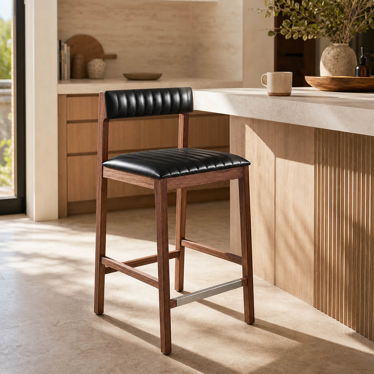 Jackson timber bar stool with upholstered leather seat beside kitchen island