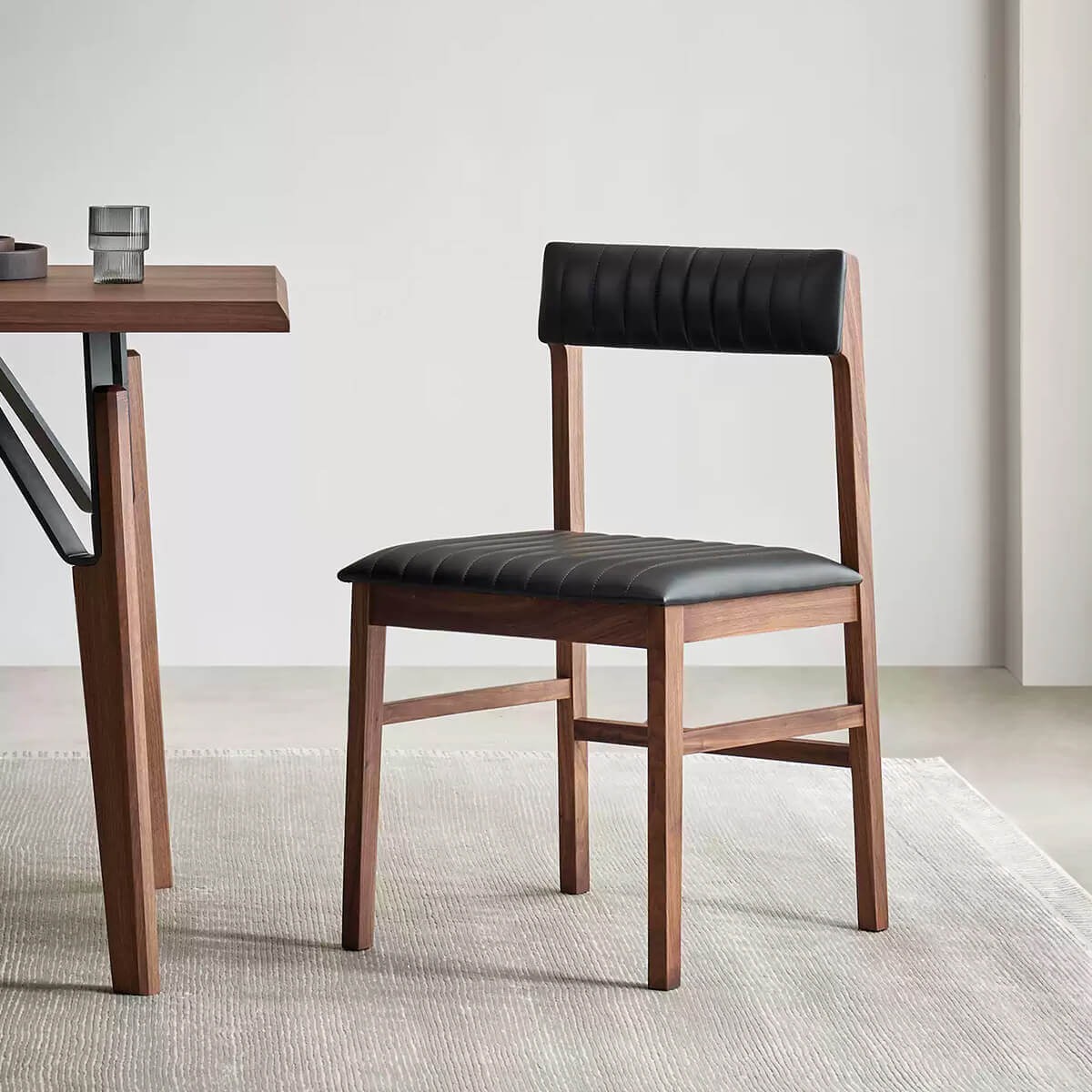 Jackson black leather dining chair with solid walnut frame