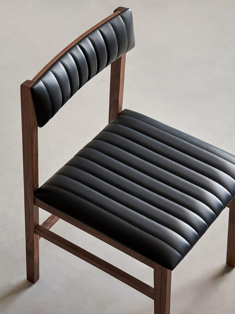 Jackson dining chair with channel-stitched black leather seat