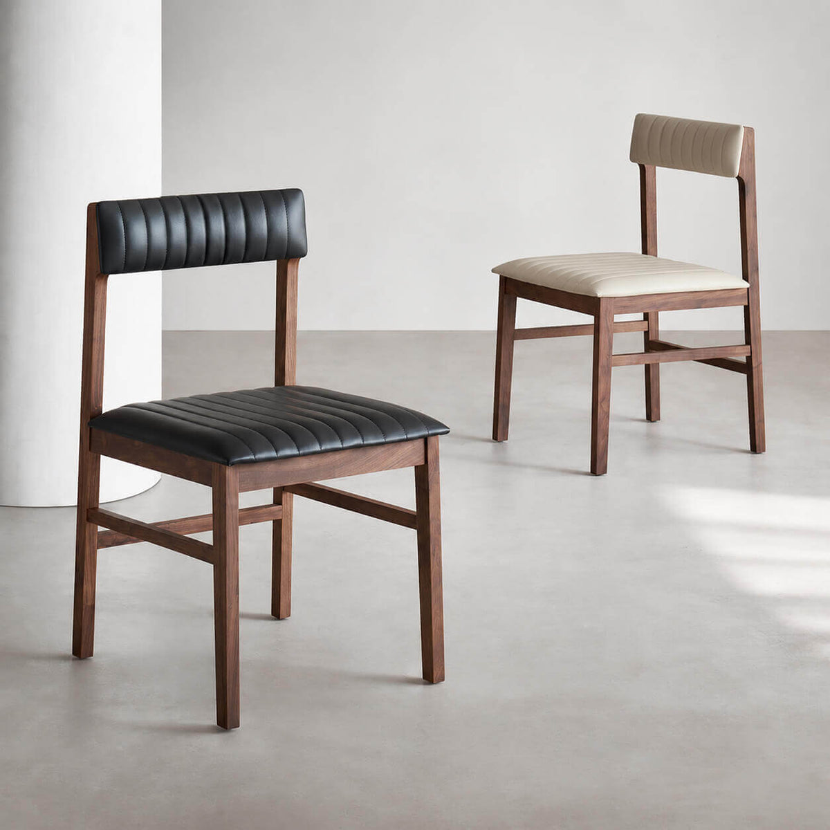 Jackson solid walnut leather dining chairs in black and off-white