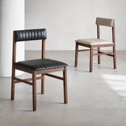 Jackson solid walnut leather dining chairs in black and off-white