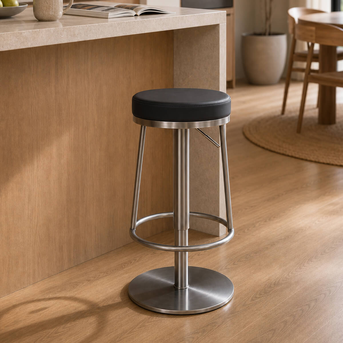 Jason Gas Lift Swivel Bar Stool in black beside a modern kitchen island