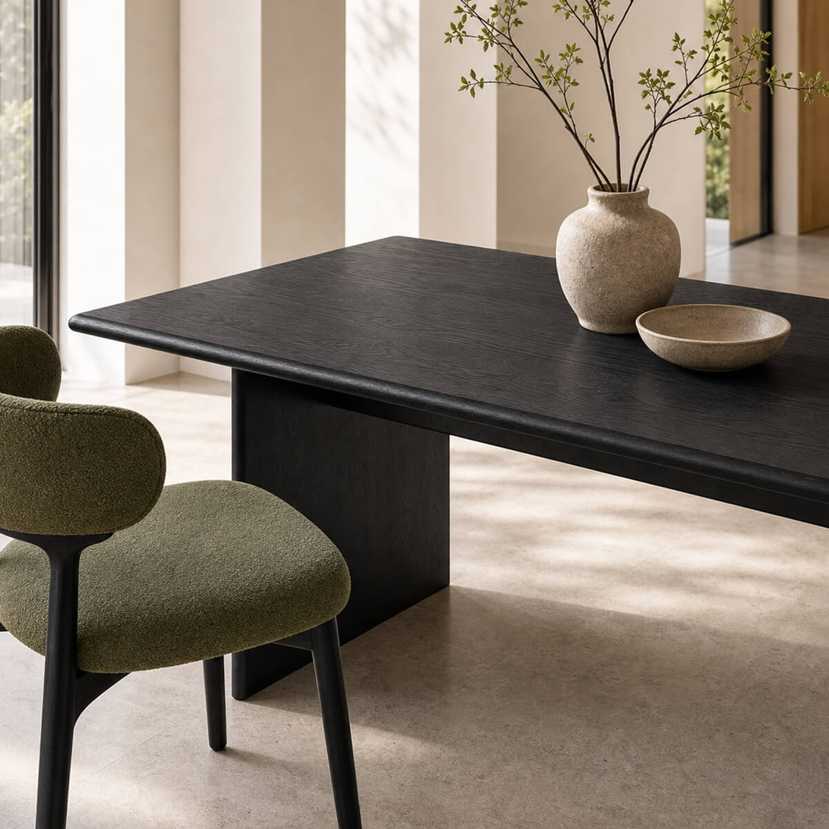 Jutti Solid ash Dining Table in black finish styled in a bright contemporary dining room
