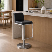 Karly Gas Lift Swivel Bar Stool beside a modern kitchen island