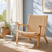 Kelaos armchair in a coastal-inspired reading corner with solid ash wood frame and handwoven rope seat