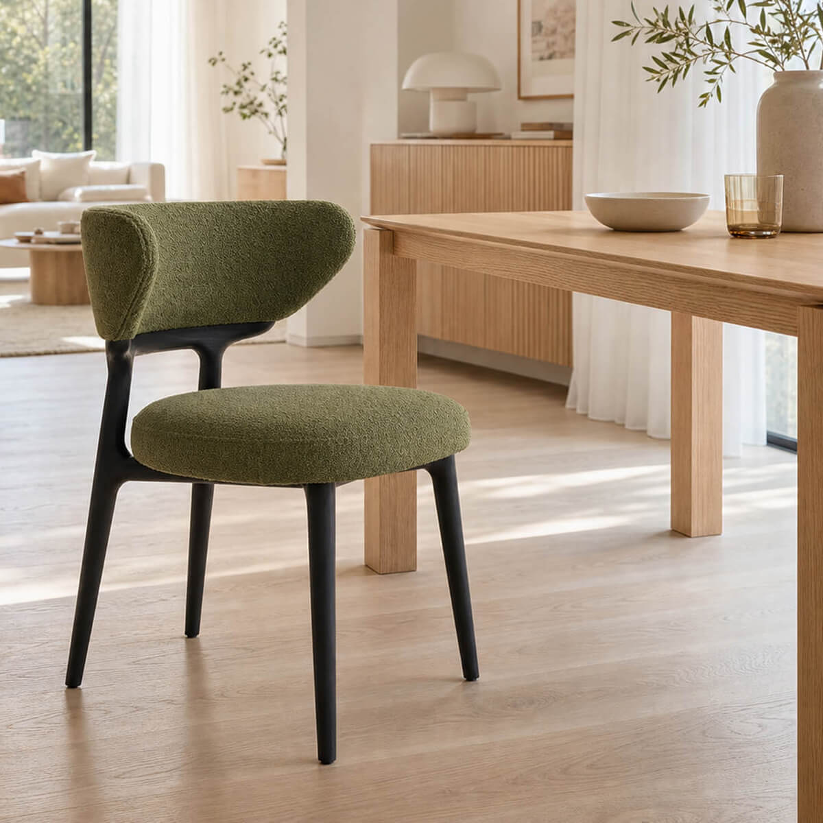 Green boucle Klara dining chair in contemporary timber dining space