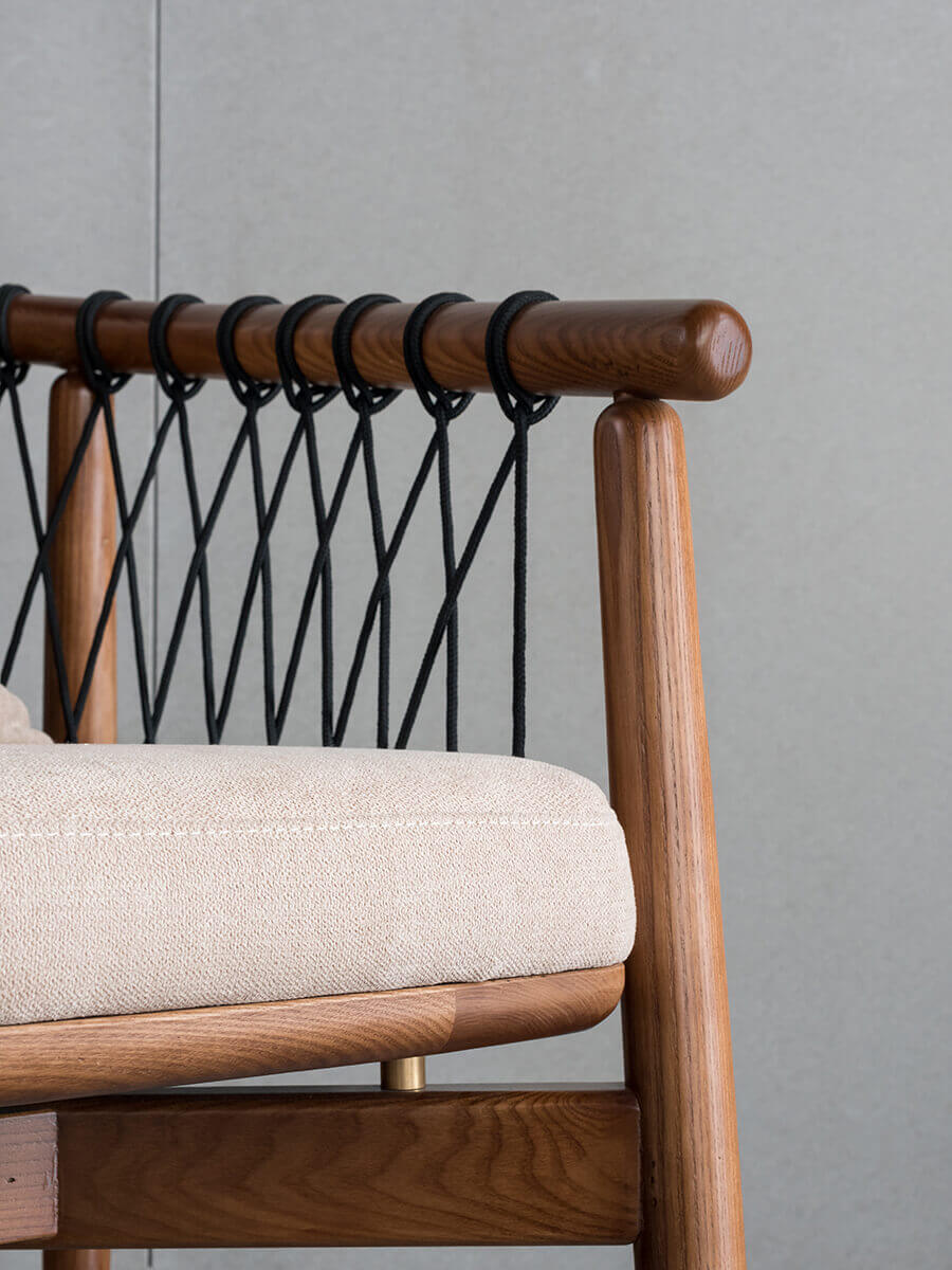 Detail of the Kniss armchair showing solid ash timber craftsmanship