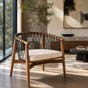 Kniss woven armchair with solid ash frame in a contemporary living room