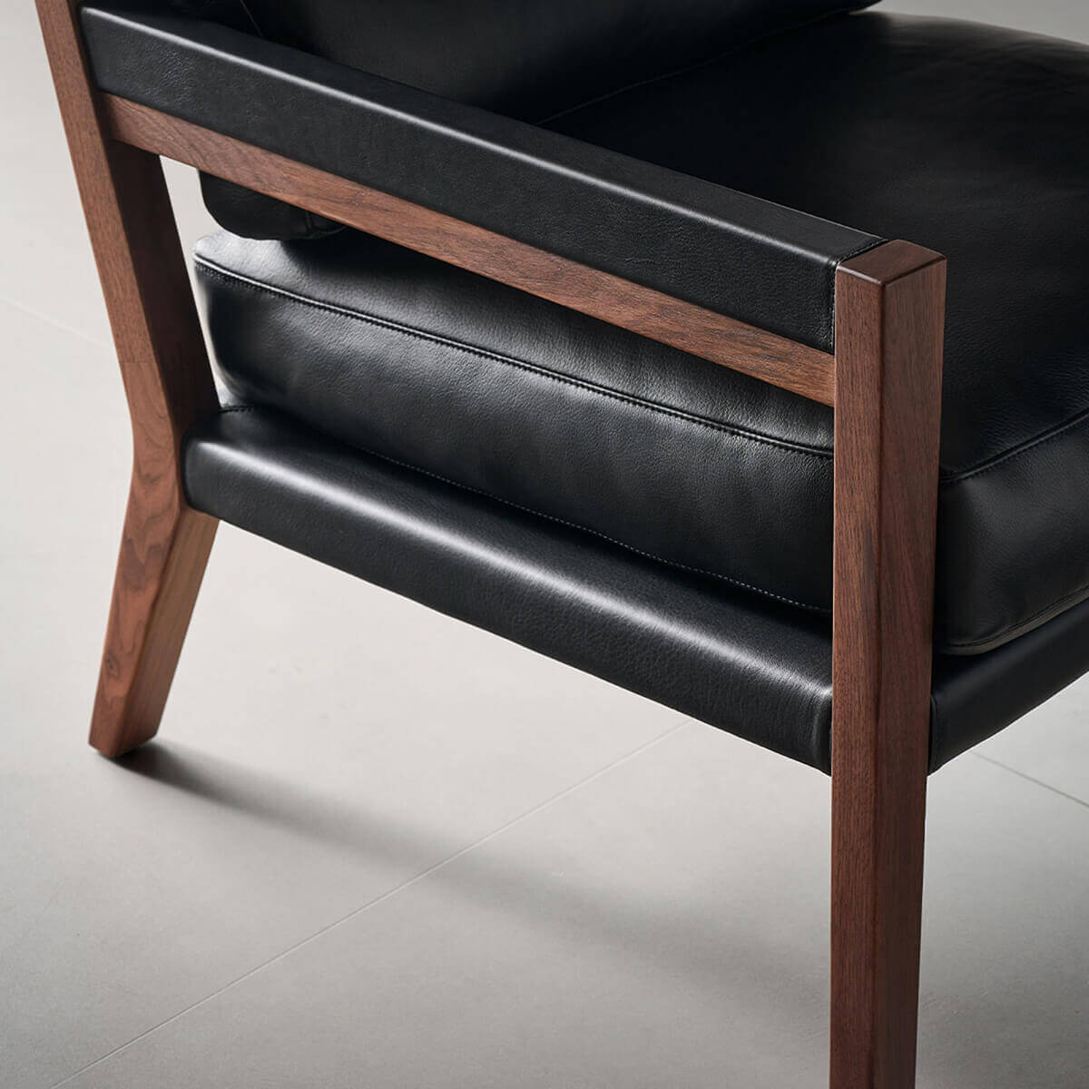 Solid black walnut frame detail of Lars Leather Armchair