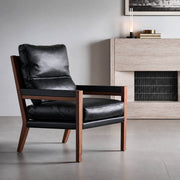 Lars Solid Walnut Leather Armchair in contemporary living room