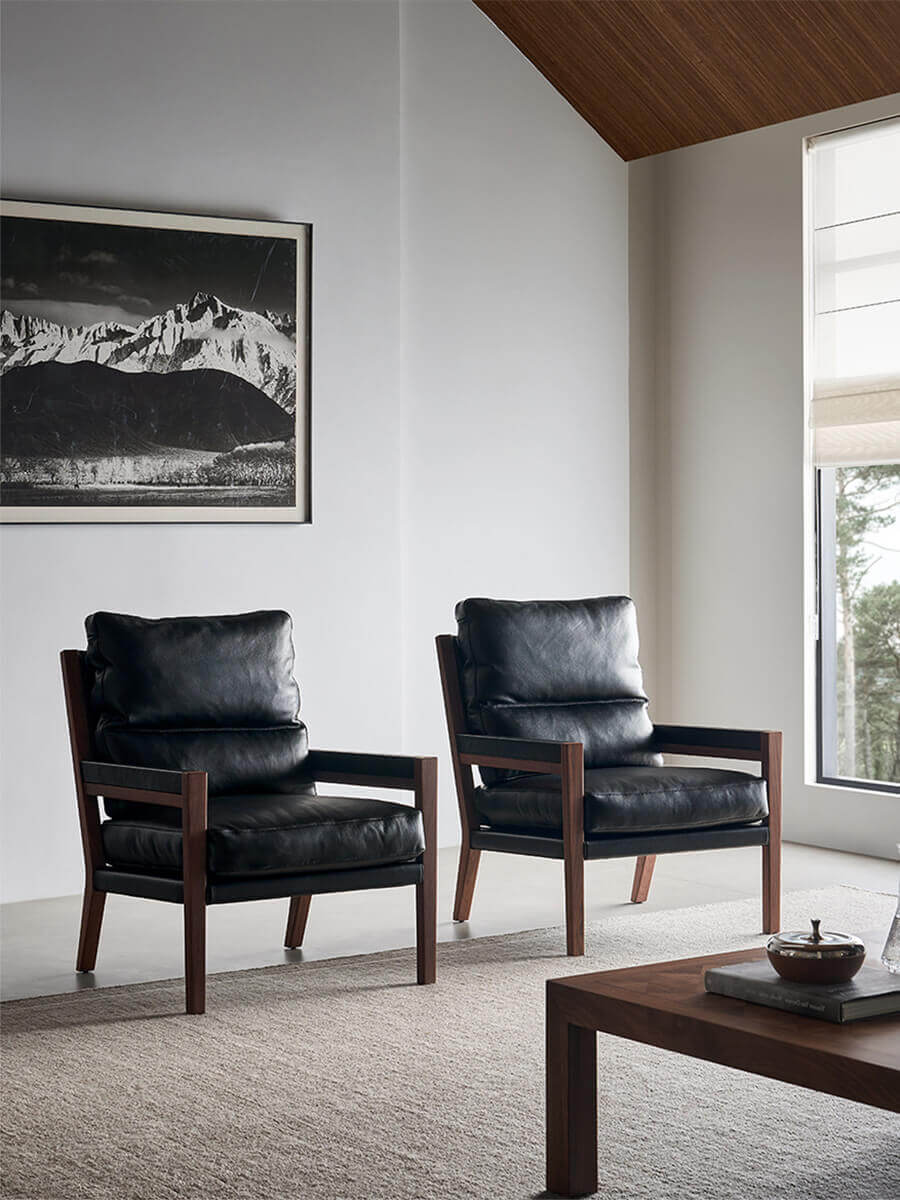 Pair of Lars Solid Walnut Leather Armchairs in contemporary interior