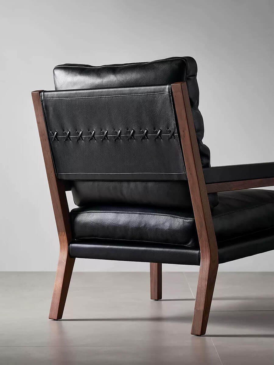 Rear view of Lars Solid Walnut Leather Armchair with handcrafted leather detailing