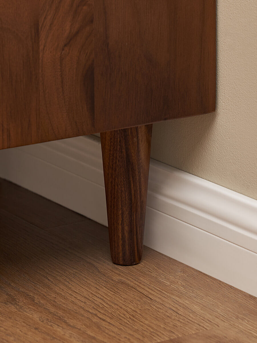 Side detail of the Linde solid walnut bedside table