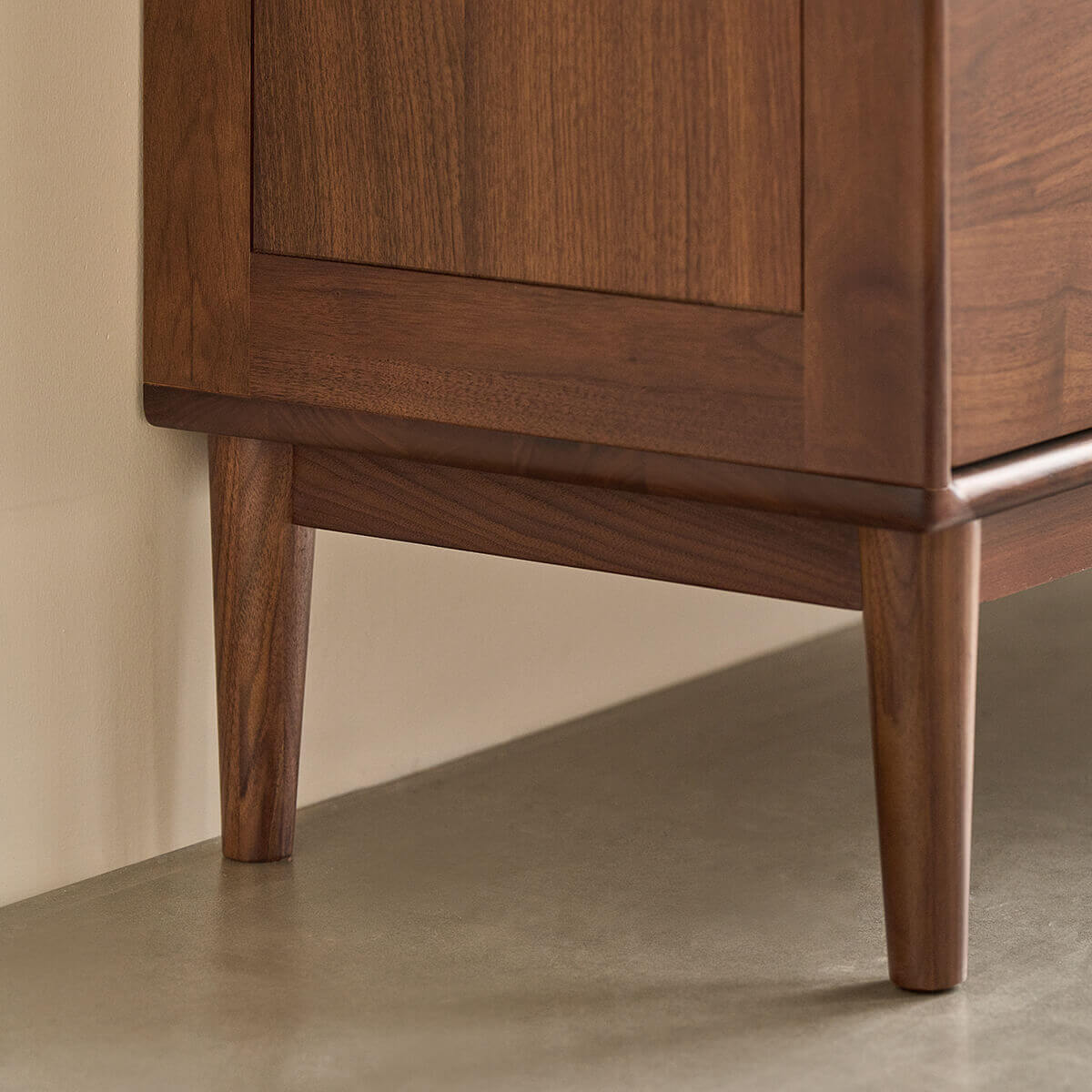 Solid walnut tapered leg detail on the Linde Chest