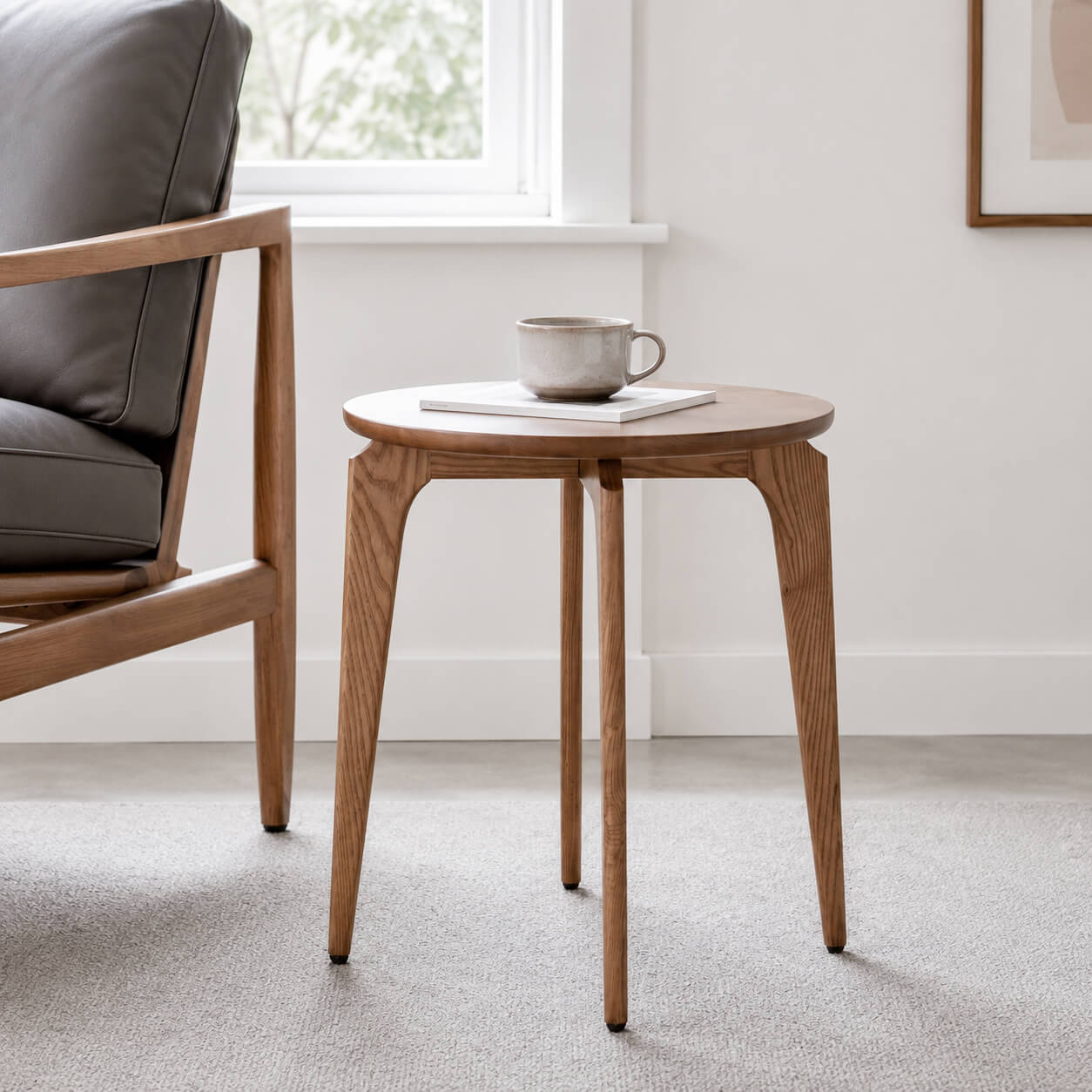 Link solid ash side table beside a lounge chair in a Scandinavian living room